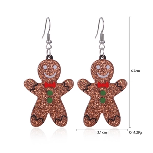 Gingerbread man earrings detail showing brown glitter finish and 6.7cm height measurement