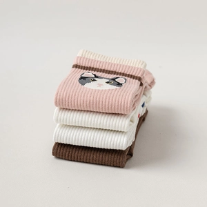 Detail of stacked cotton toe socks featuring cute cat embroidery and ribbed texture