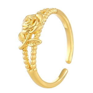 Golden rose flower open ring with intricate twisted band on a clean white background