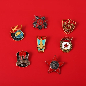 Detailed flat lay of seven USSR Soviet enamel pin badges with red star and rocket themes