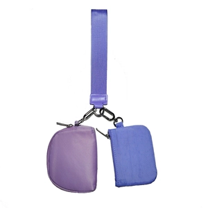 Detail of lavender wristlet set showing round pouch and rectangular nylon mini bag