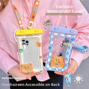 Detail of waterproof phone pouches with cartoon bears and blue grid patterns and neck lanyards