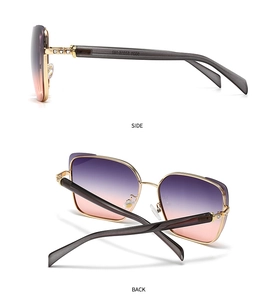 Detail view of gold metal frames with purple gradient lenses and rhinestone hinge accents