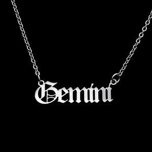 Macro detail of Gemini gothic pendant necklace in polished stainless steel finish