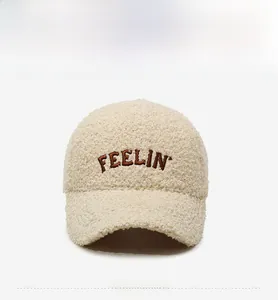 Detailed macro view of the fluffy lamb wool texture and FEELIN embroidery on this baseball cap