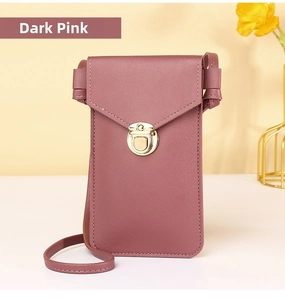 Detail of dark pink leather phone bag featuring a gold round lock and fine stitching
