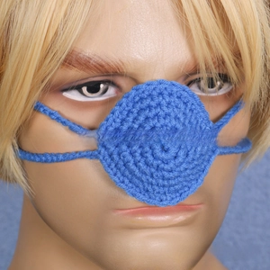 Close-up of handmade blue crochet nose warmer on a model head for party costumes