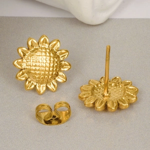 Golden sunflower earrings in 304 stainless steel with 18k gold plating shown on grey background