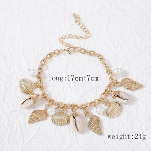 Vintage Baroque gold chain bracelet featuring conch shells, seashells and imitation pearls
