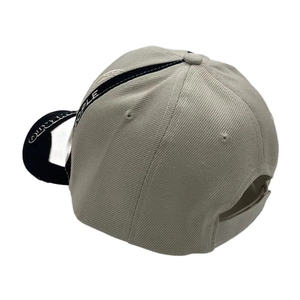 Detailed back view of beige baseball cap with black trim and Gentle People embroidery