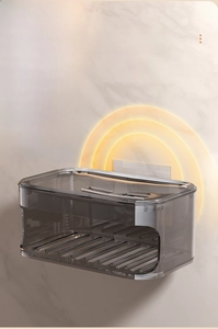 Macro detail of wall-mounted smoke gray soap box with drainage bars and easy installation