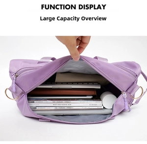 Top view of purple travel bag interior showing large capacity for laptops and magazines