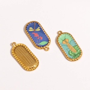 Detail of vintage style koi carp pendants with dragonfly and mantis enamel patterns