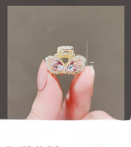 Detail view of a pink rhinestone bunny ear hair claw clip measuring 2.1cm by 1.6cm