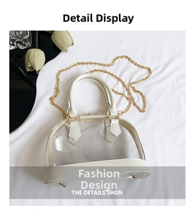 Detailed top view of a transparent PVC shell bag with white leather trim and gold chain strap