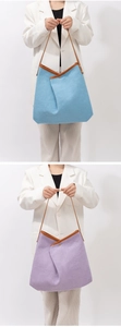 Detailed close-up showing woven texture and leather handles of light blue and purple tote bags