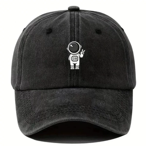 Detail of vintage washed dark gray cotton baseball cap featuring embroidered astronaut logo