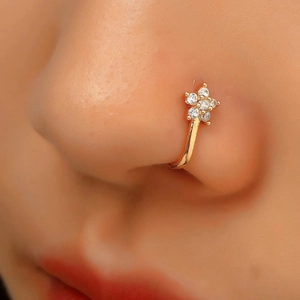 Detail view of gold S925 sterling silver nose cuff with sparkling diamond flower cluster