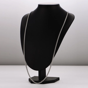 Minimalist stainless steel woven link chain necklace displayed on a black neck bust