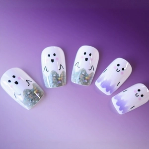 Halloween ghost theme press-on nails in white and purple gradient with glitter accents