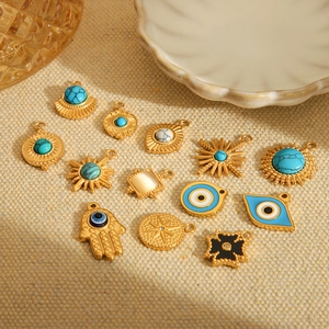 Golden stainless steel evil eye and hand pendants with turquoise insets for DIY jewelry