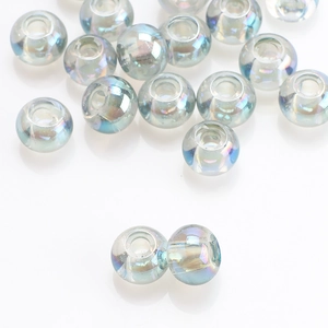 Macro shot of 8x10mm round iridescent glass beads with holes for DIY jewelry making