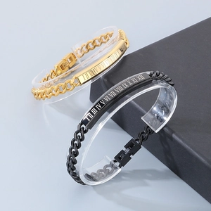 Detail of stainless steel Cuban chain bracelet with Roman numeral engraved plate