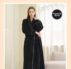Detail of premium black flannel bathrobe featuring classic shawl collar and white piping trim