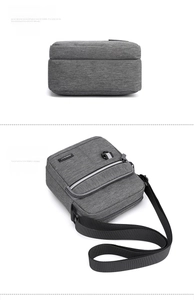 Detailed bottom and tilted view of gray oxford fabric men shoulder bag with zipper