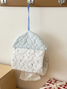Close-up of heart quilted house-shaped hanging tissue holder with rabbit embroidery