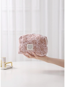Pink corduroy makeup bag with white lace floral embroidery and top zipper closure