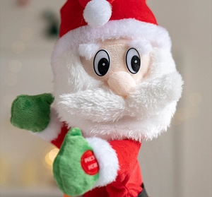 Close-up of dancing Santa toy showing press button for musical interaction