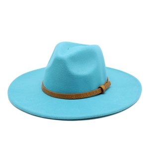 Detail of teal fedora hat showing textured brown leather band and metallic buckle