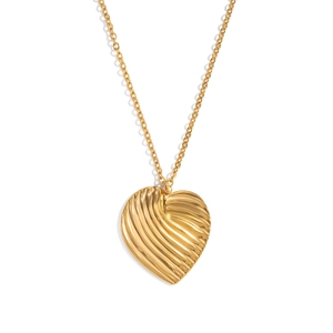 Close-up of golden heart pendant with ripple texture on a minimalist cable chain link