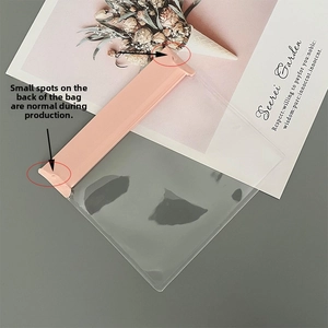 Close-up of a clear plastic jewelry storage bag with a pink seal and durable PE material