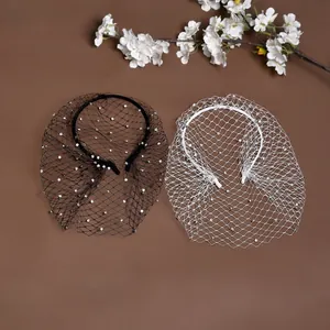 Detail view of black and white mesh bridal headbands with sparkling rhinestones decoration