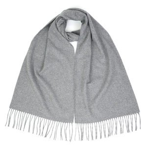 Close-up of soft gray autumn winter scarf with fringe detail and woven texture