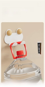 Strong load-bearing cartoon frog wall hook holding a heavy water bottle with sealant fix glue