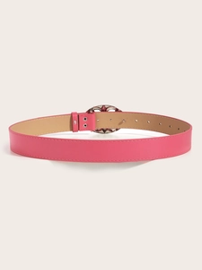 Detailed view of pink leather belt with silver rhinestone buckle and soft beige lining