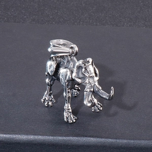 Detail of vintage silver elephant skeleton pendant with distressed metal texture