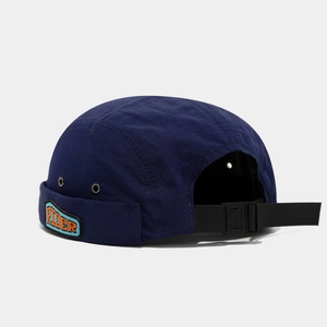 Detail of navy blue nylon docker hat with RIDER embroidery and adjustable buckle strap