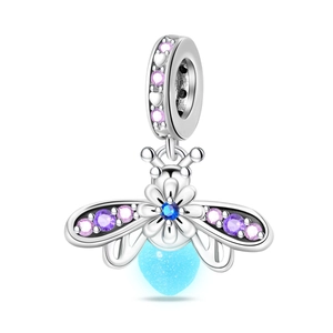 Detailed view of silver firefly charm with glowing heart and colorful zircons