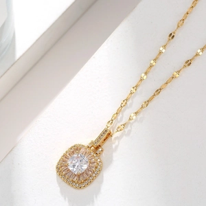 Elegant gold necklace featuring a square pendant set with brilliant sparkling zircons