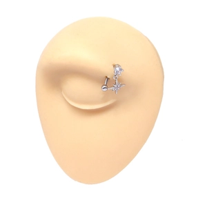 Close-up of a silver eyebrow ring with an octagonal star pendant and clear zircon inlay
