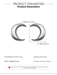 Detail view of silver crescent moon earrings showing 2.5cm height and 2cm width dimensions