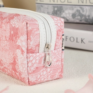 Pink printed waterproof PVC cosmetic bag with white zipper for travel makeup storage