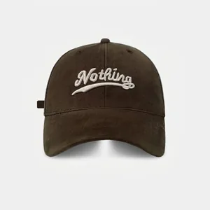 Deep brown cotton baseball cap with white Nothing script embroidery for a casual look