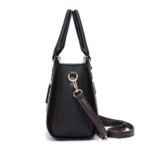 Fashionable black pebbled leather tote bag for women with golden hardware and brown strap