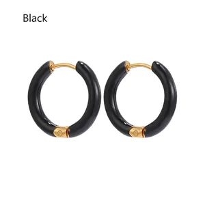 Detail of 12mm black enamel stainless steel hoop earrings with gold-tone hinge clasp