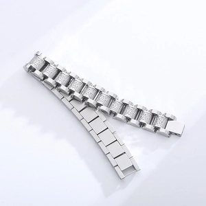 Detailed macro view of silver CNC crystal paved link chain bracelet in watch band style